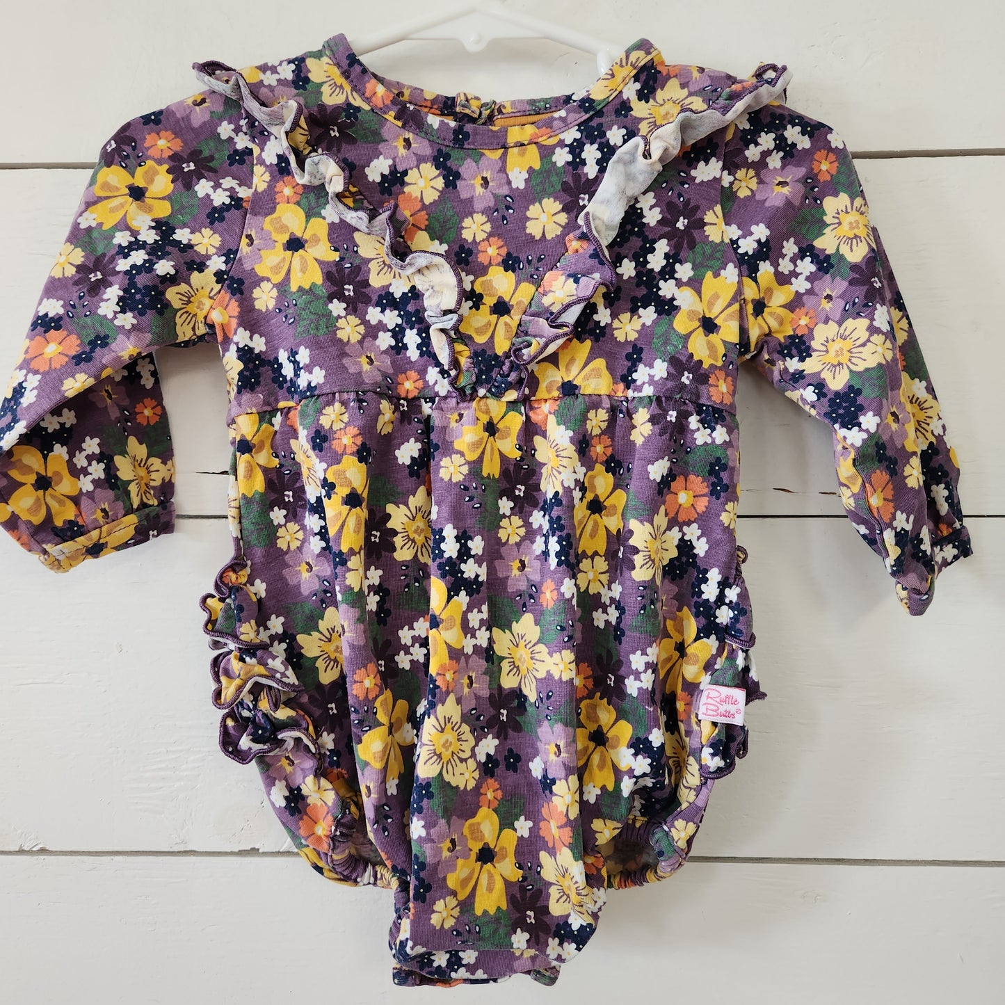 Size 6-12m | Ruffle butts Floral onsie