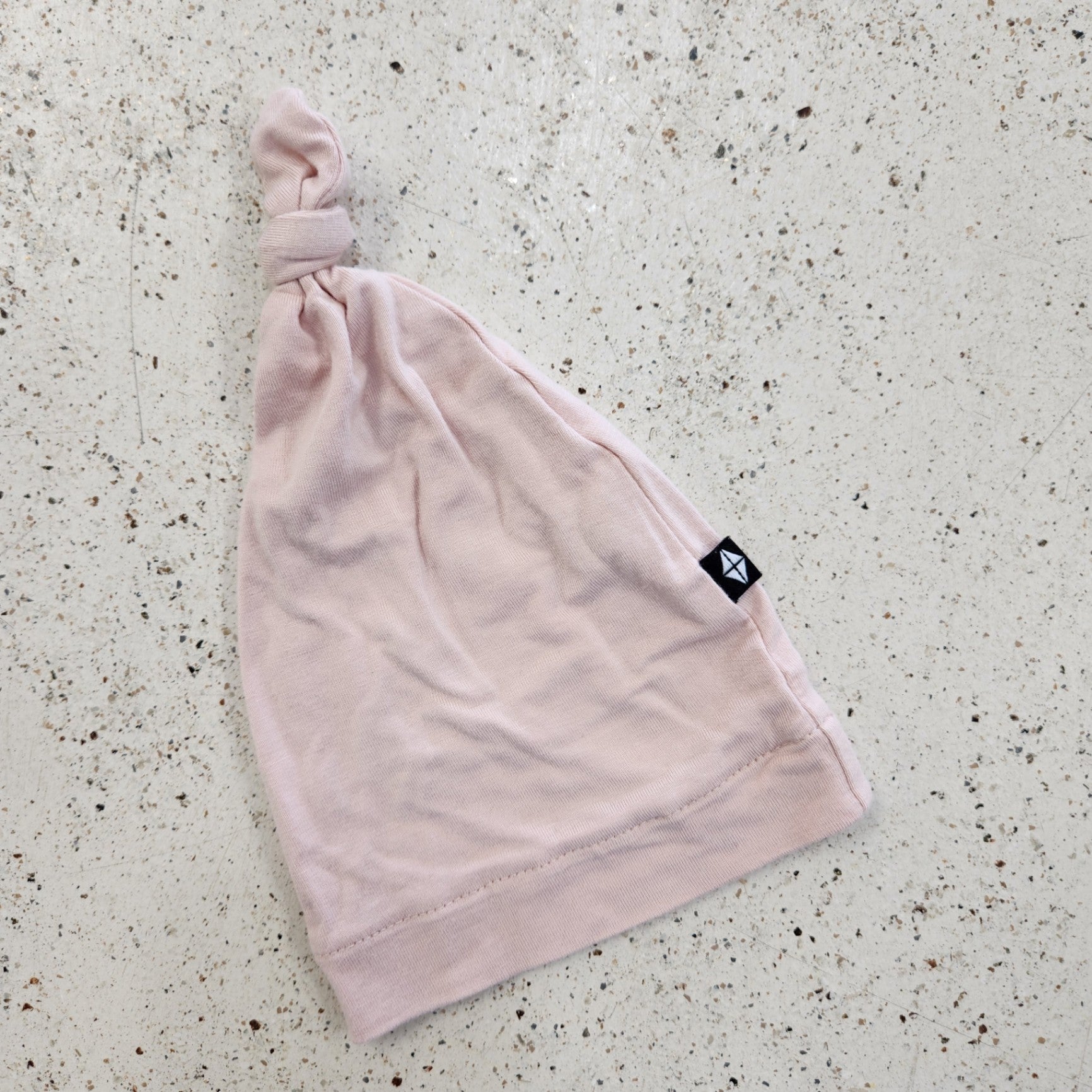 Size NB | Kyte Baby Pink Top Knot Hat | UBNUU